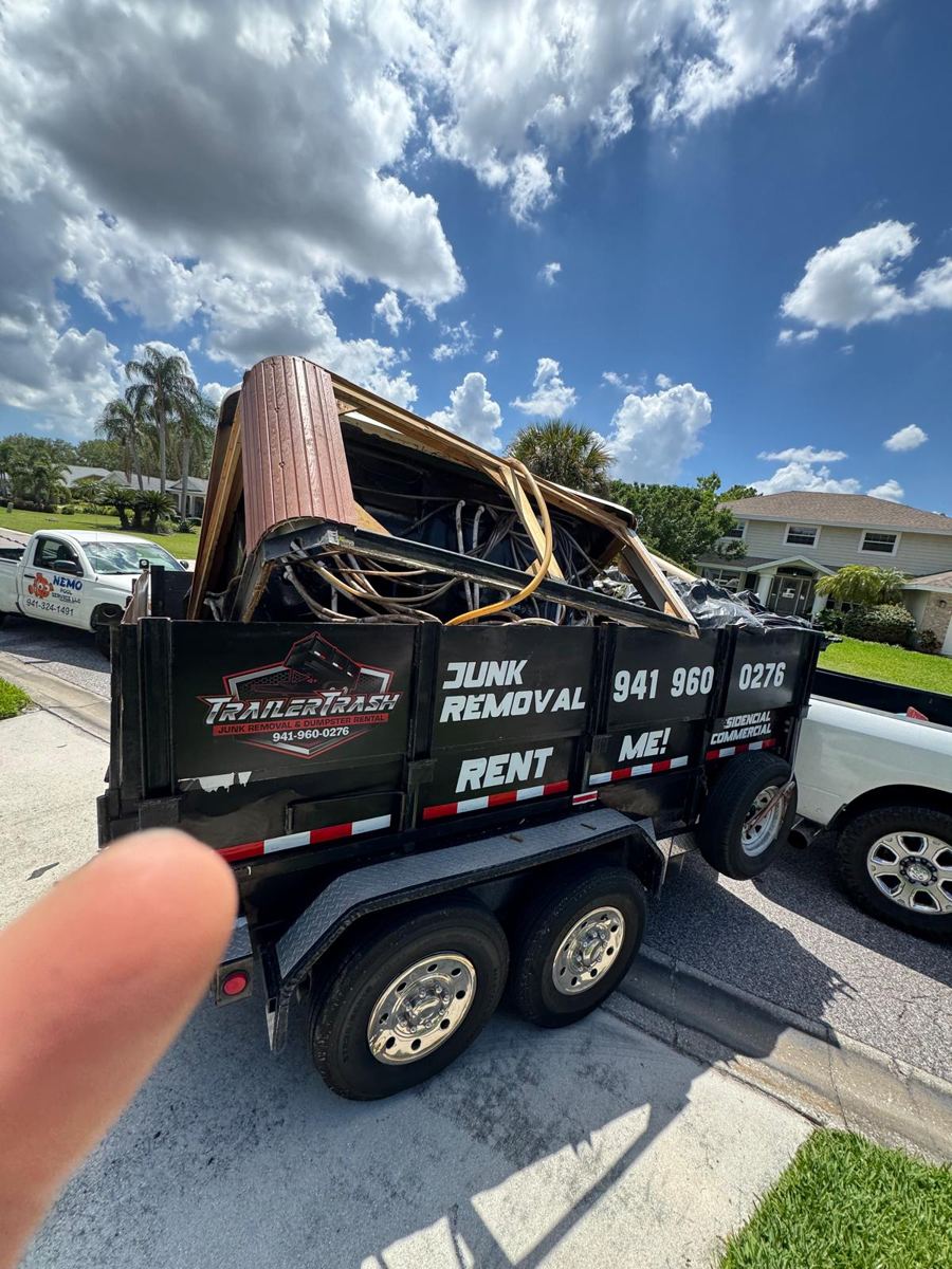 Old hot tub loaded onto an Orval trailer for removal